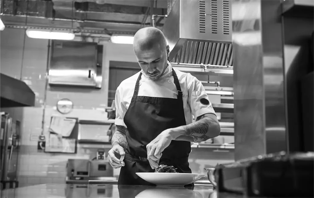 Chef preparing gourmet dish in Dubai